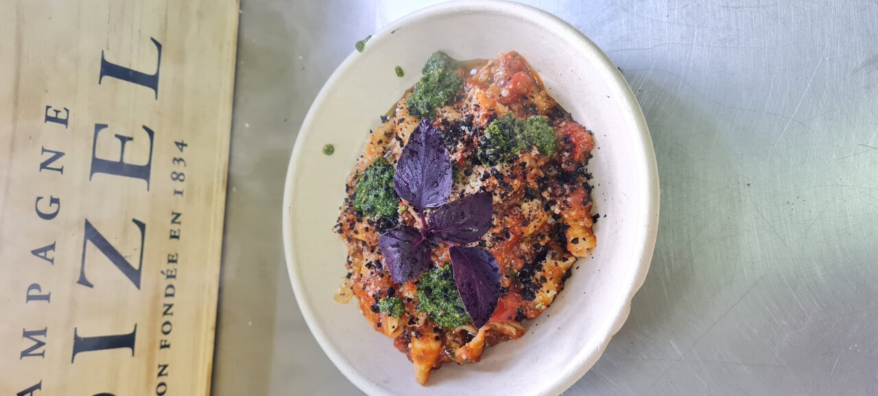 Fresh pasta with ragù, pesto and purple basil