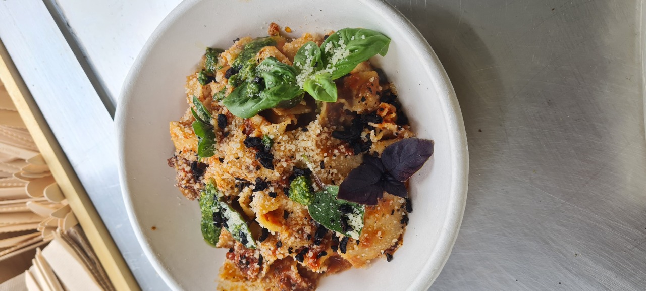 Fresh pasta with tomato, olive crumb and basil